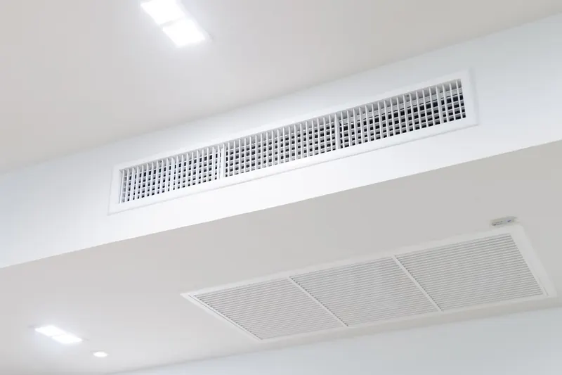 Ducted air conditioning grilles in a ceiling bulkhead